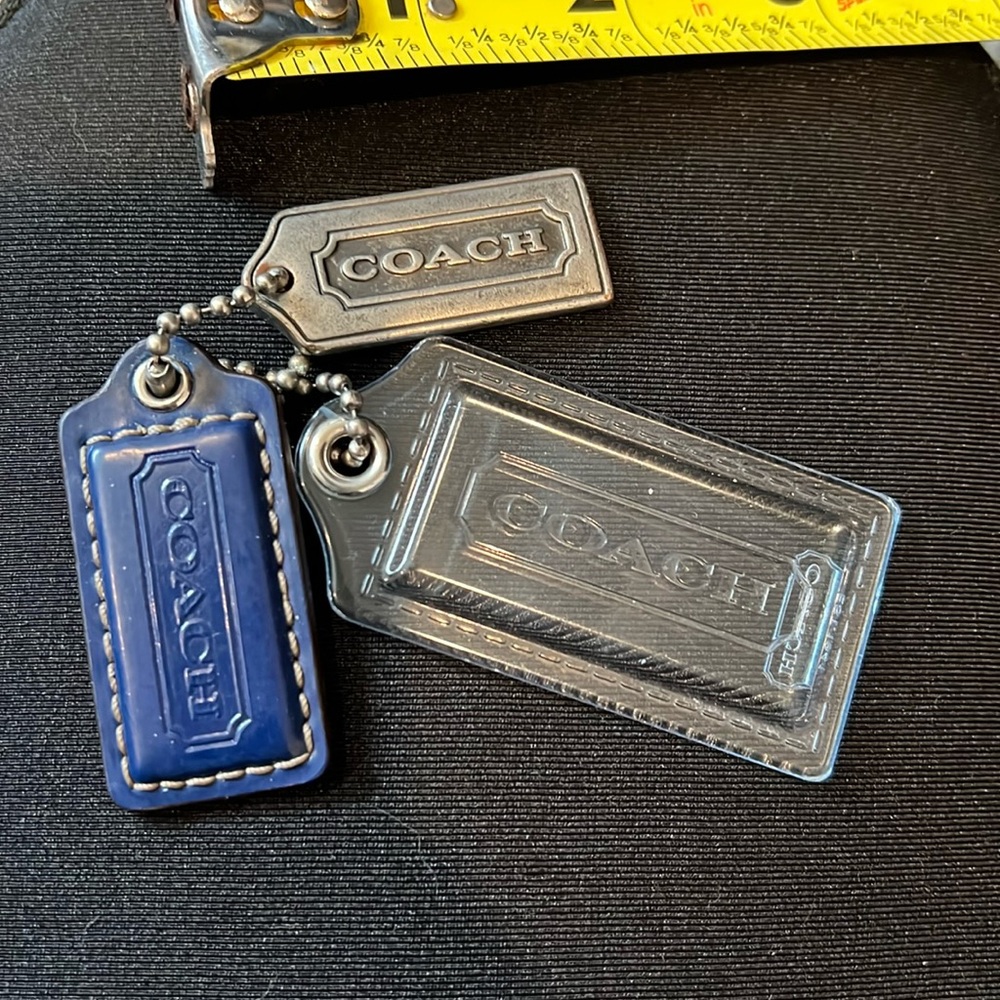 Coach Hang Tags set of 3 
Metal 1.5” - Leather 1.5 - Plastic 2 inch